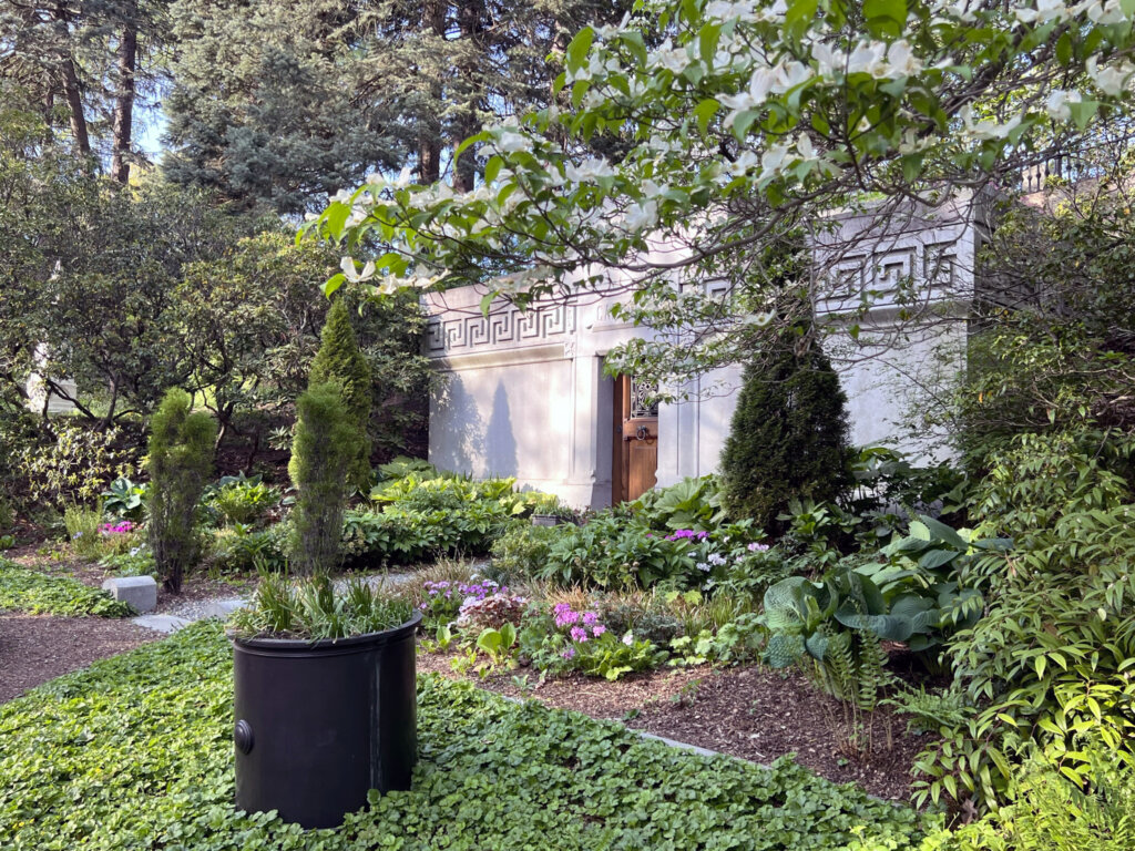 A mausoleum surrounded by lush greenery