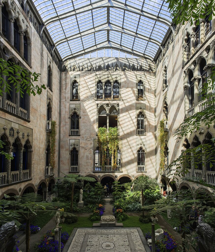 A landscaped garden atrium with a glass roof