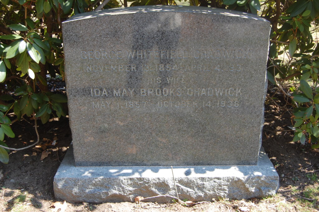 A photograph of a simple upright granite gravestone monument.