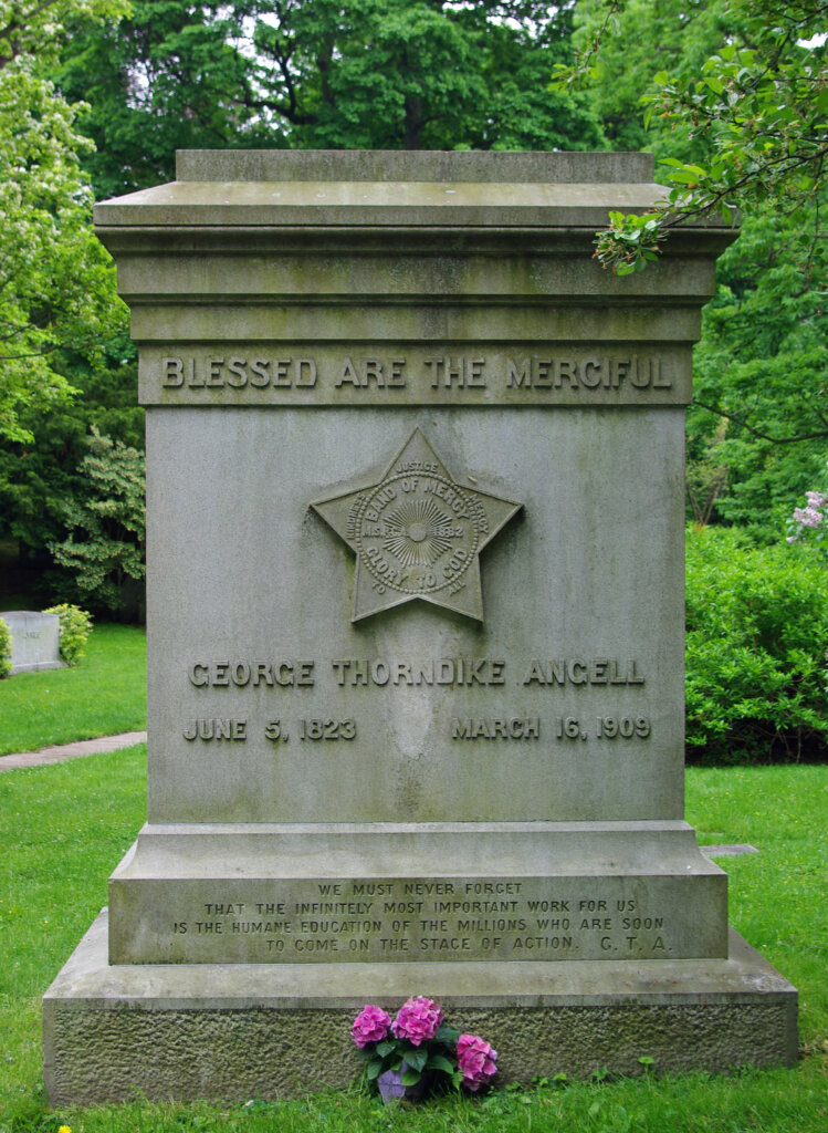 a photograph of a granite gravestone monument with a star carved into it. 