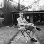 Architect and designer Ben Thompson sits in front of his house in Lexington, a contemporary house he designed.