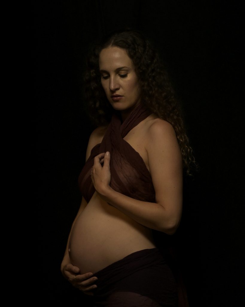 Pregnant woman in a ballet costume