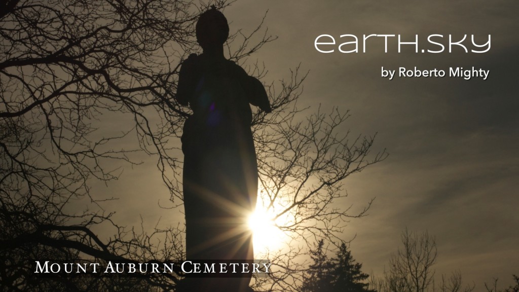 Poster image for earth.sky exhibit shows a marble statue in shadow with light rays from sun streaking the sky.